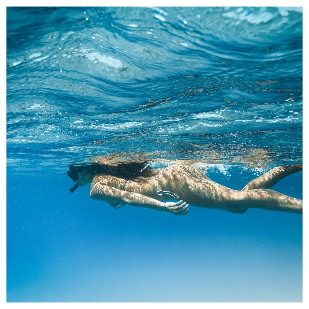 A woman snorkeling