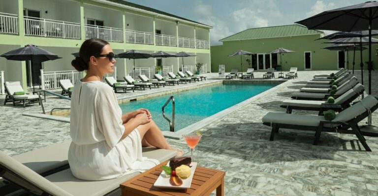 Woman eating cake poolside
